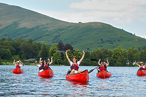 A group of people on a guided canoe tour on Loch Lomond