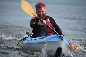 A person Kayaking on Loch Lomond