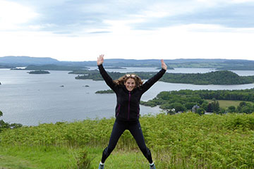 A person Jumping over looking Loch Lomond